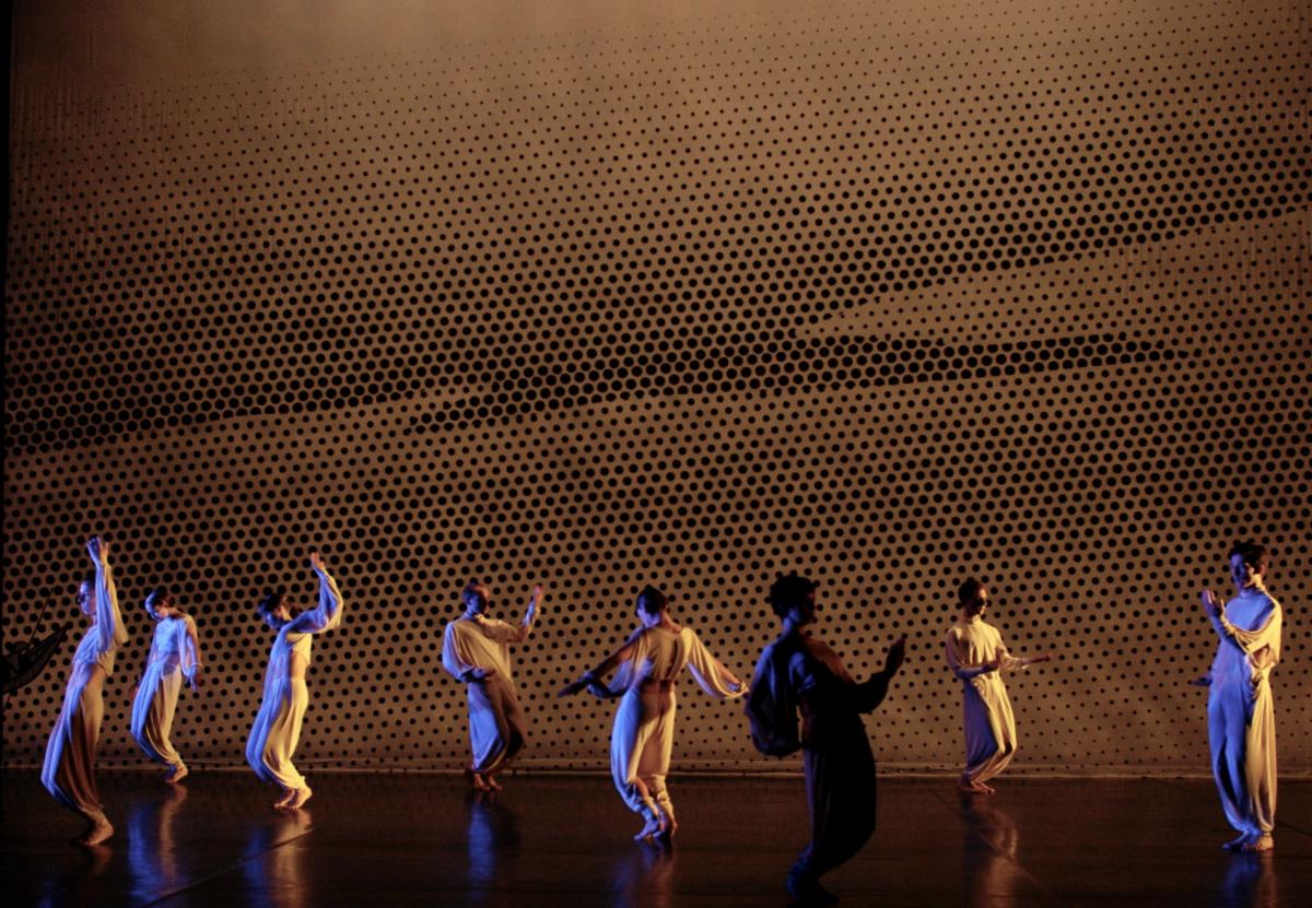 A group of people dancing on stage

Description automatically generated