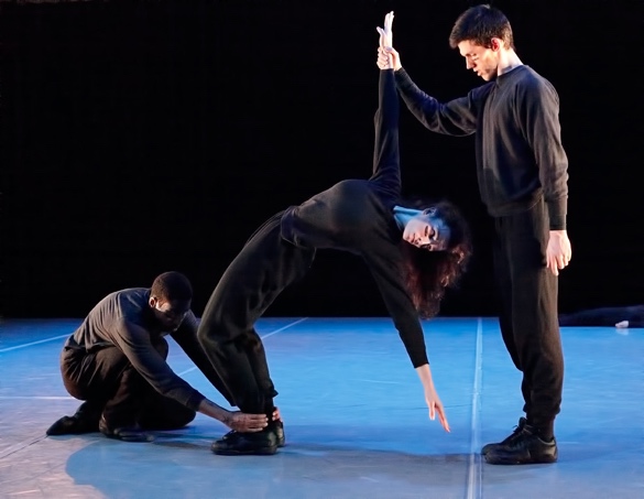 A group of people performing on stage

Description automatically generated