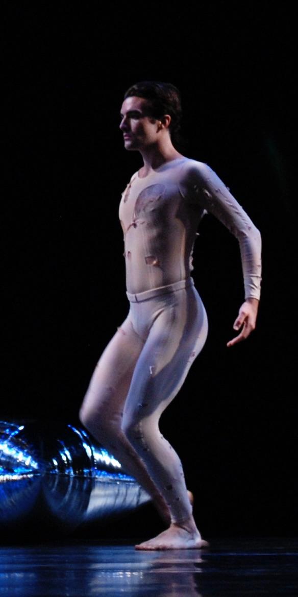 A person in a white outfit

Description automatically generated