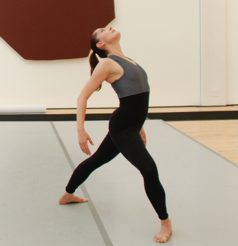 A person in a black leotard

Description automatically generated