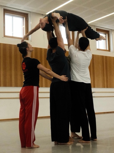 A group of people holding each other

Description automatically generated