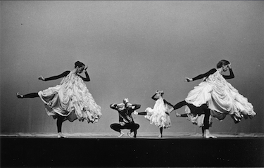 A group of women dancing on a stage

Description automatically generated