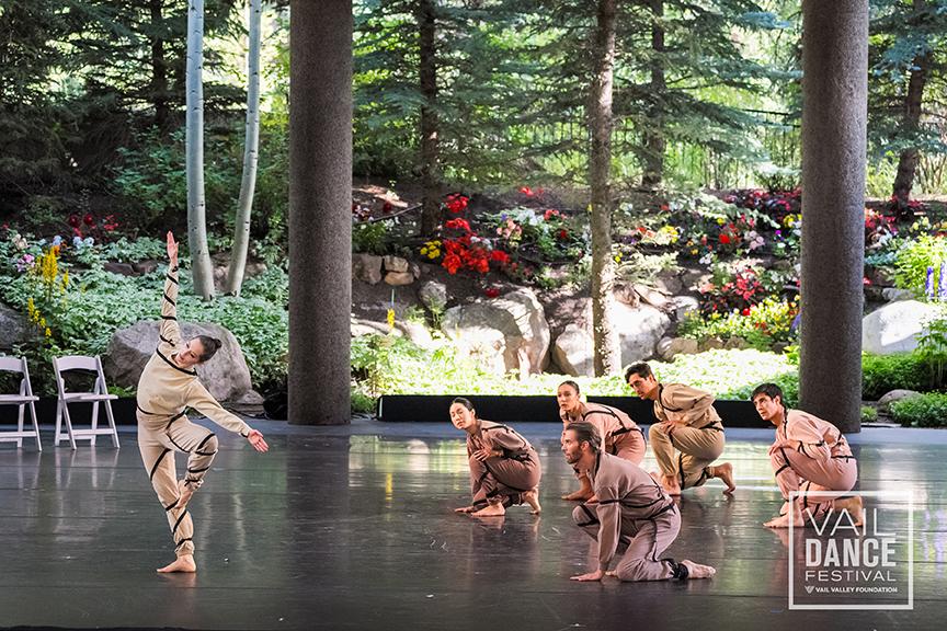 A group of people performing on stage

Description automatically generated