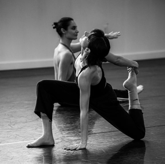 Two women in black and white

Description automatically generated