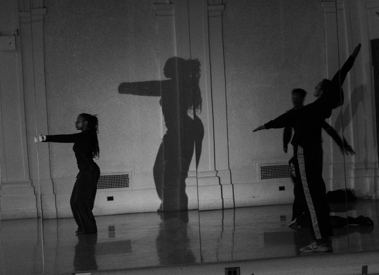 A group of people dancing on a stage

Description automatically generated