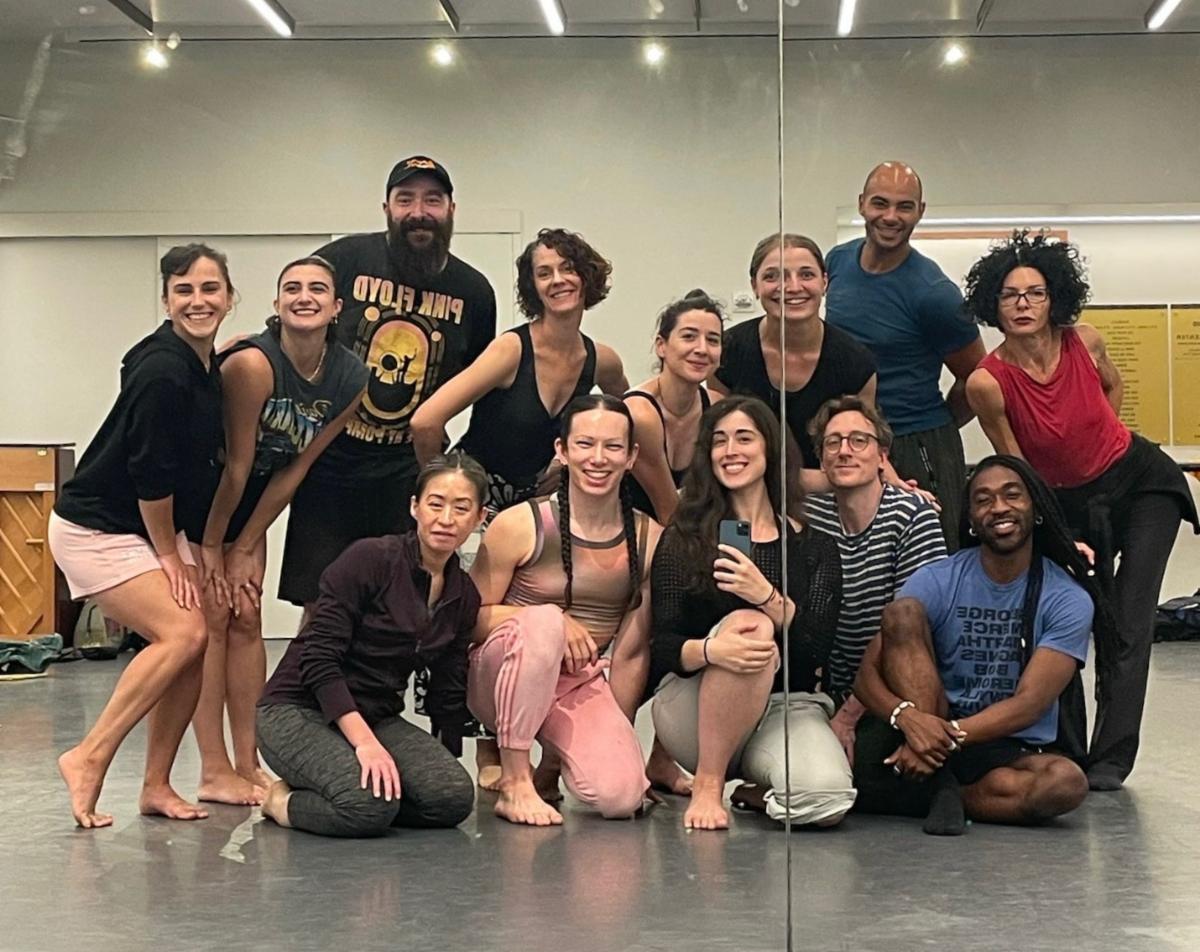 A group of people posing for a photo

Description automatically generated