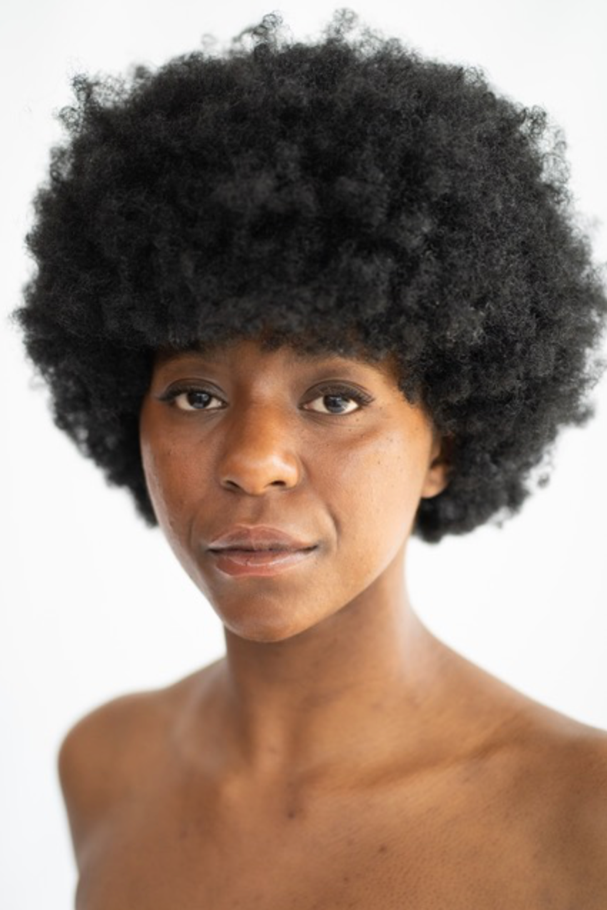A person with a puffy afro

Description automatically generated