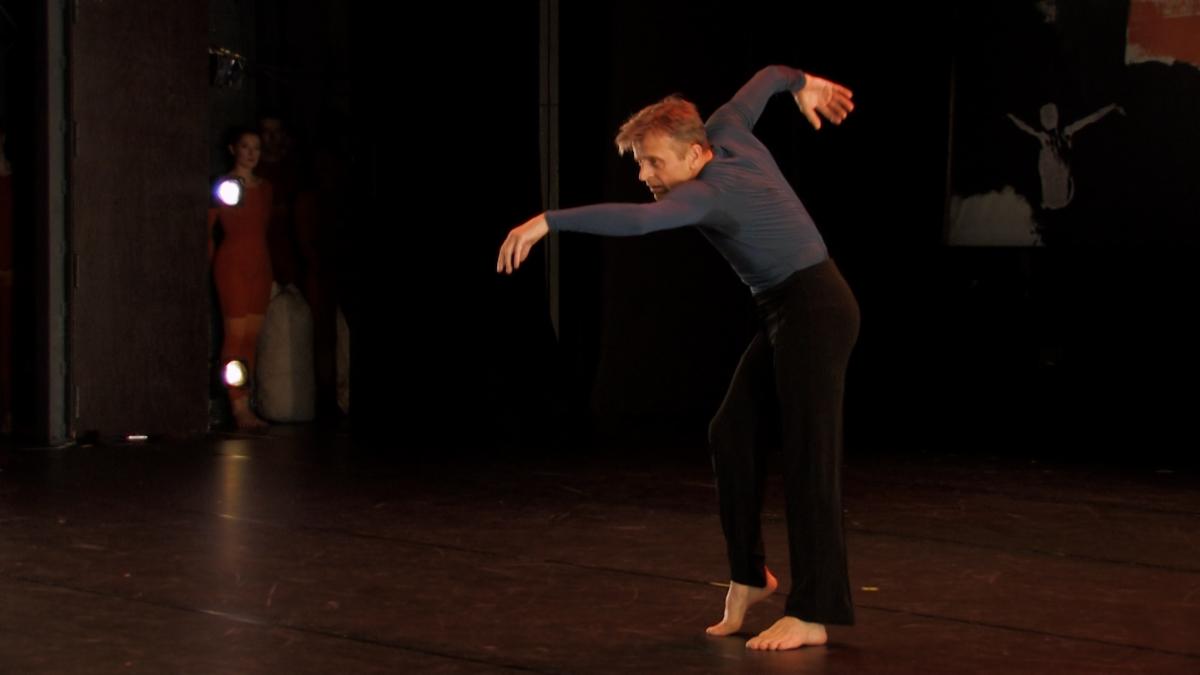 A person dancing on a stage

Description automatically generated