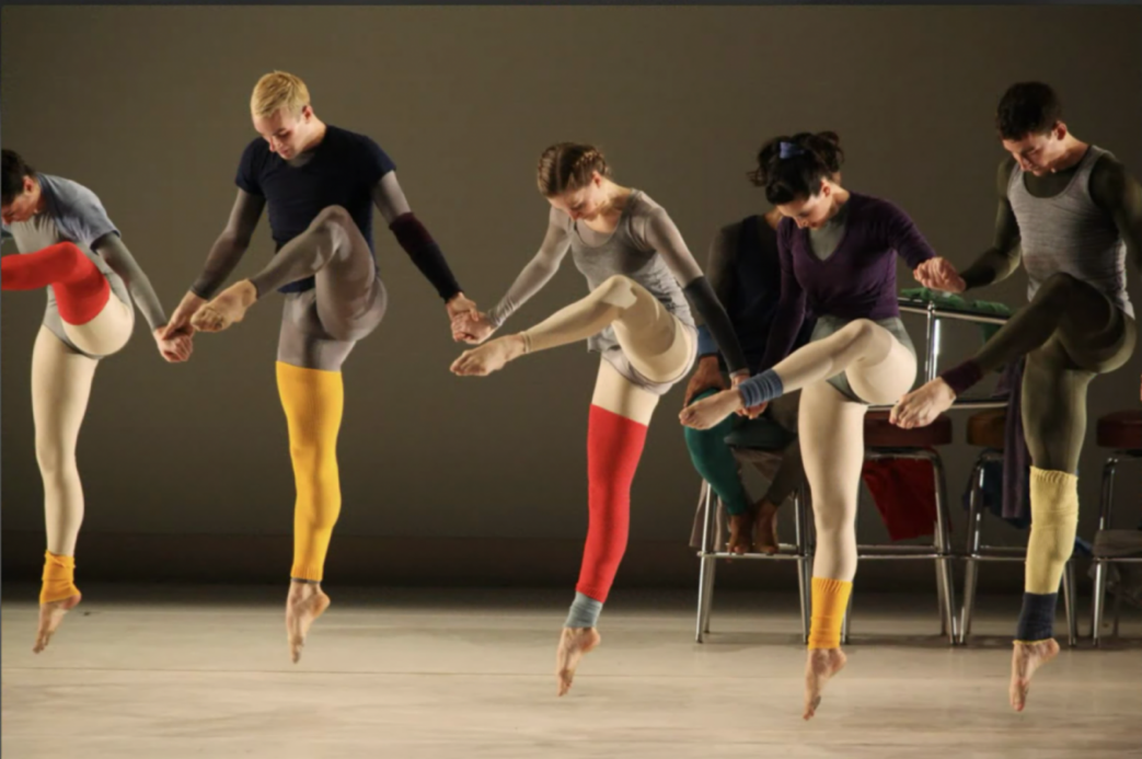 A group of people dancing

Description automatically generated