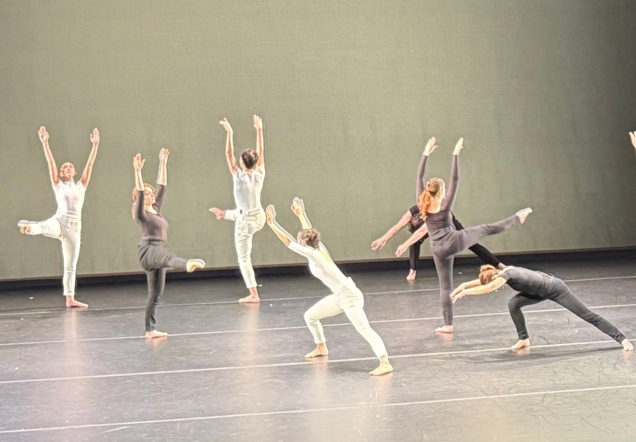 A group of women dancing on a stage

Description automatically generated
