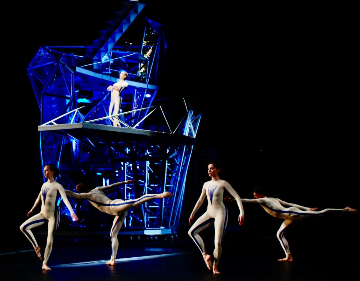 A group of people dancing on stage

Description automatically generated