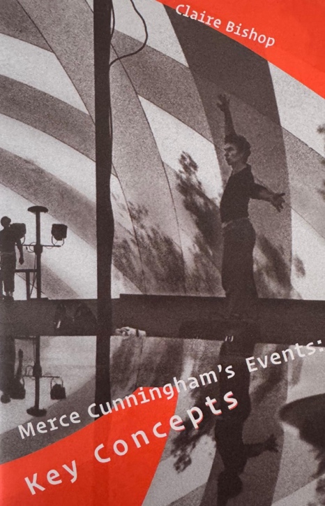 A person on a bridge with his arms outstretched

Description automatically generated