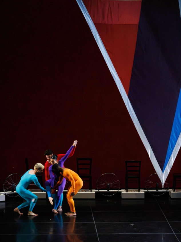 A group of people dancing on stage

Description automatically generated