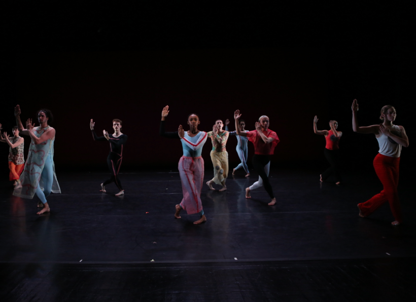 A group of people dancing on a stage

Description automatically generated